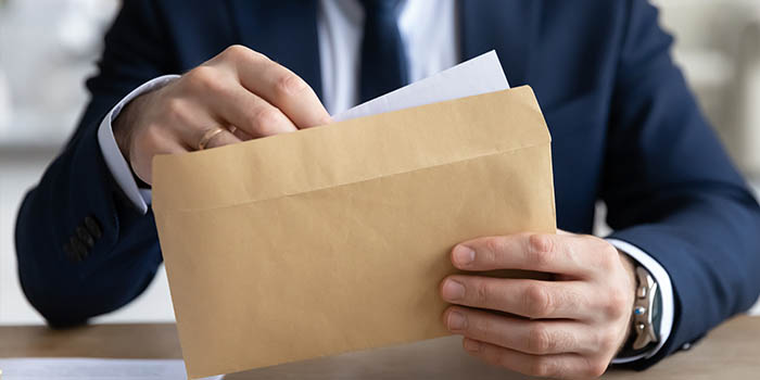 Businessman opens a letter